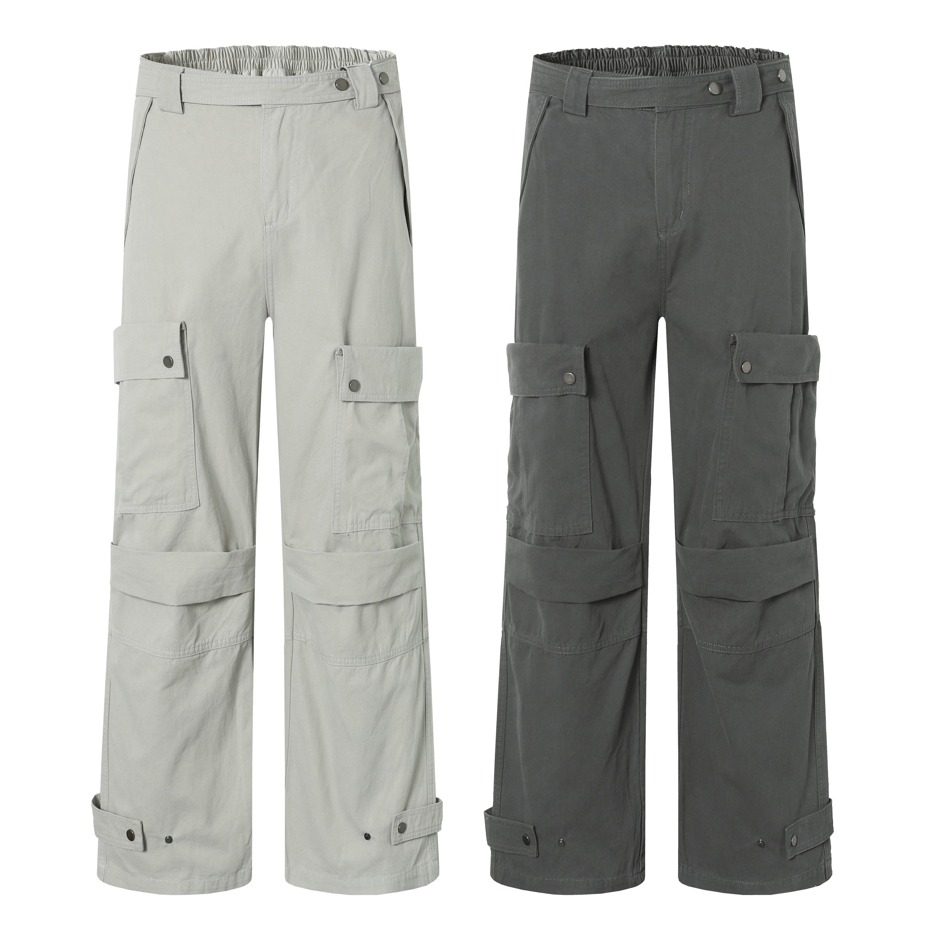 Light grey and dark charcoal wide-leg cargo pants with dual-layer snap pockets and adjustable hem straps, shown side by side