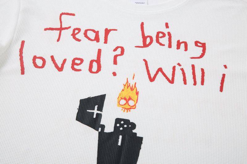Front graphic close-up with red handwritten text, flame icon, and black doodle figure