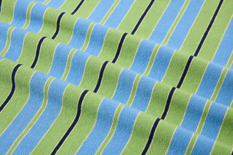 Close-up of rippled striped fabric texture in blue and green