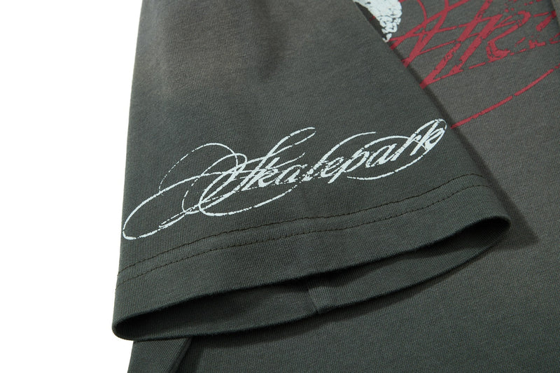 Dark olive vintage graphic polo tee with white script and red print on the sleeve hem