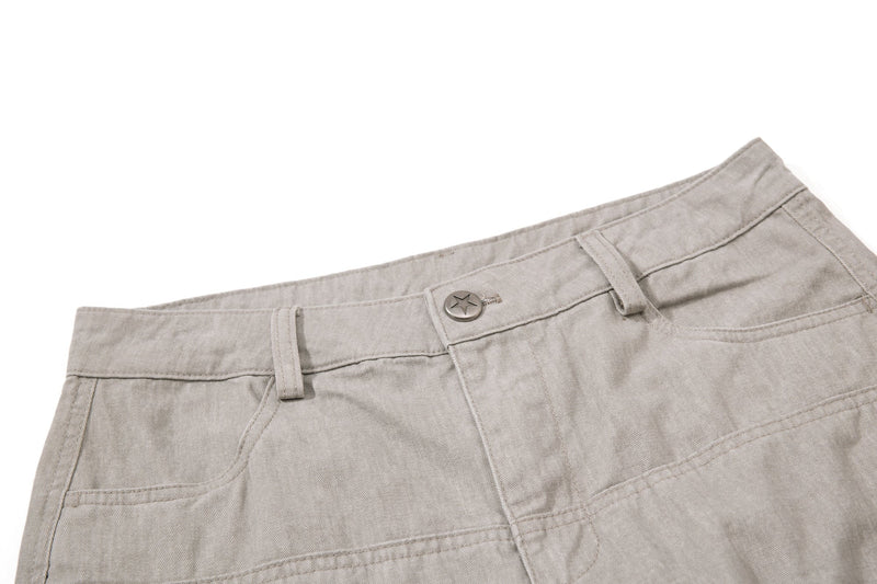 Beige waistband detail on cargo pants with star button and belt loops