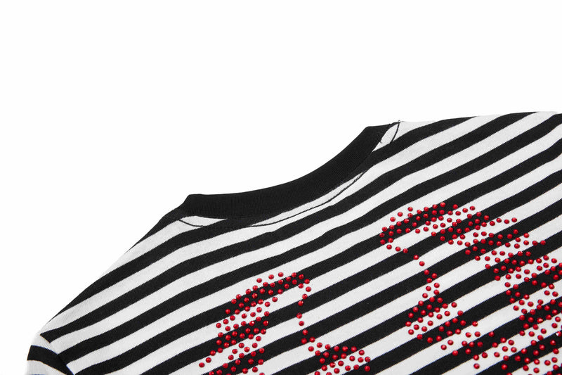 Black and white striped tee with red rhinestone gothic script detail on the chest and a black crew neckline