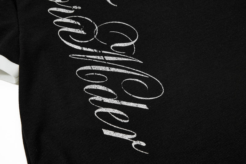 Black polo shirt with white gothic script graphic and contrast white collar for streetwear style