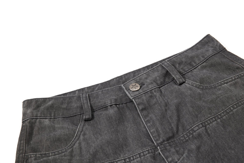 Close-up of dark gray pants waistband with star button and belt loops