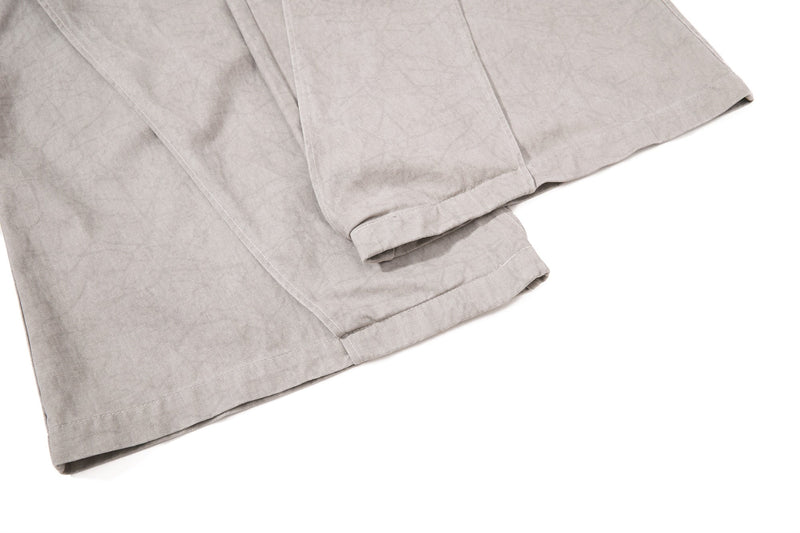 Light beige denim hem close-up with folded wide-leg cuff
