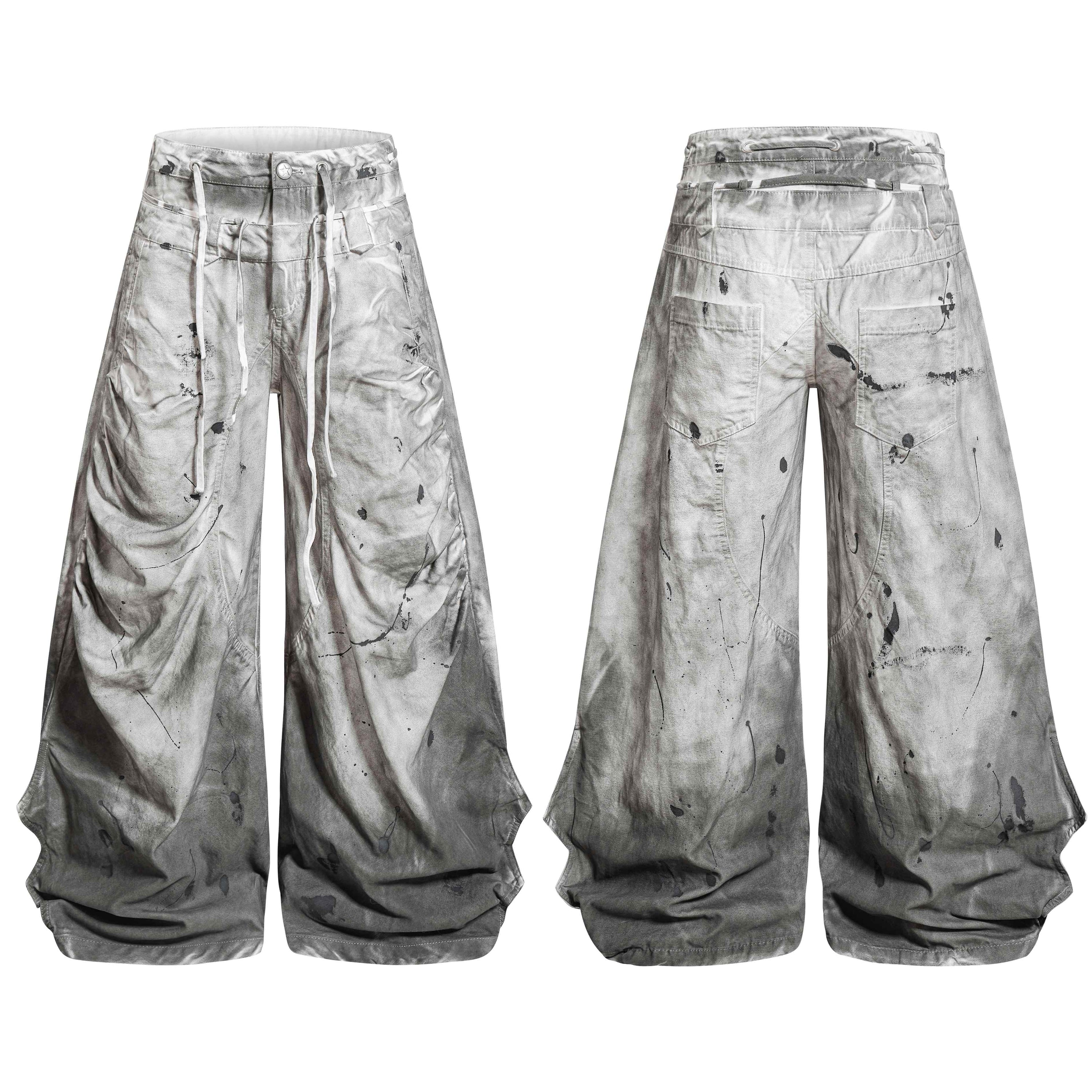 Front and back view of grey dirty wash balloon jeans with paint splatter detailing and extended white drawstrings