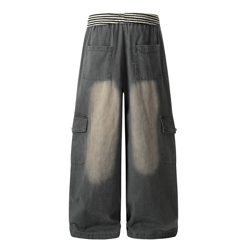 Back view of charcoal washed wide-leg cargo pants with patch back pockets and striped elastic waist
