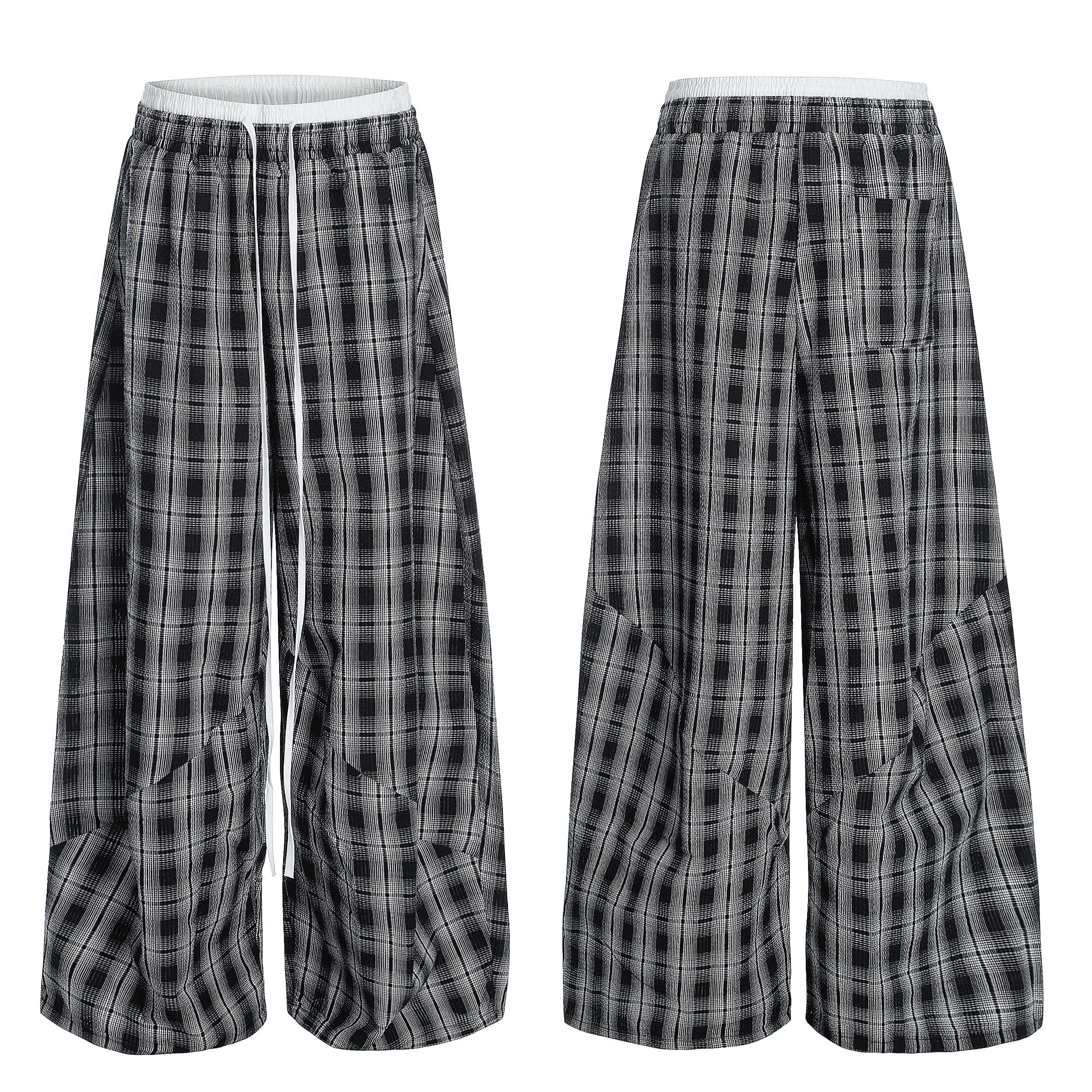 Front and back view of black and white plaid barrel-leg wide-leg pants with white elastic waistband and drawstring