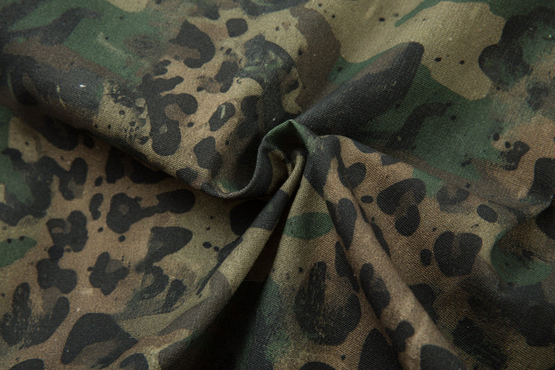 Close-up of gathered camo leopard fabric texture and print