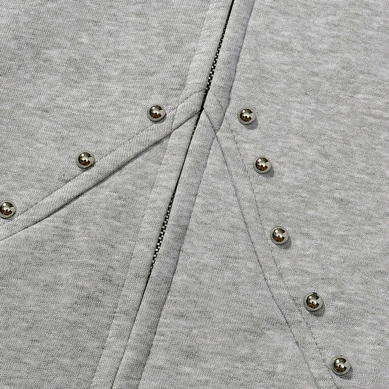 Gray zip hoodie close-up of front arc seams and center zipper