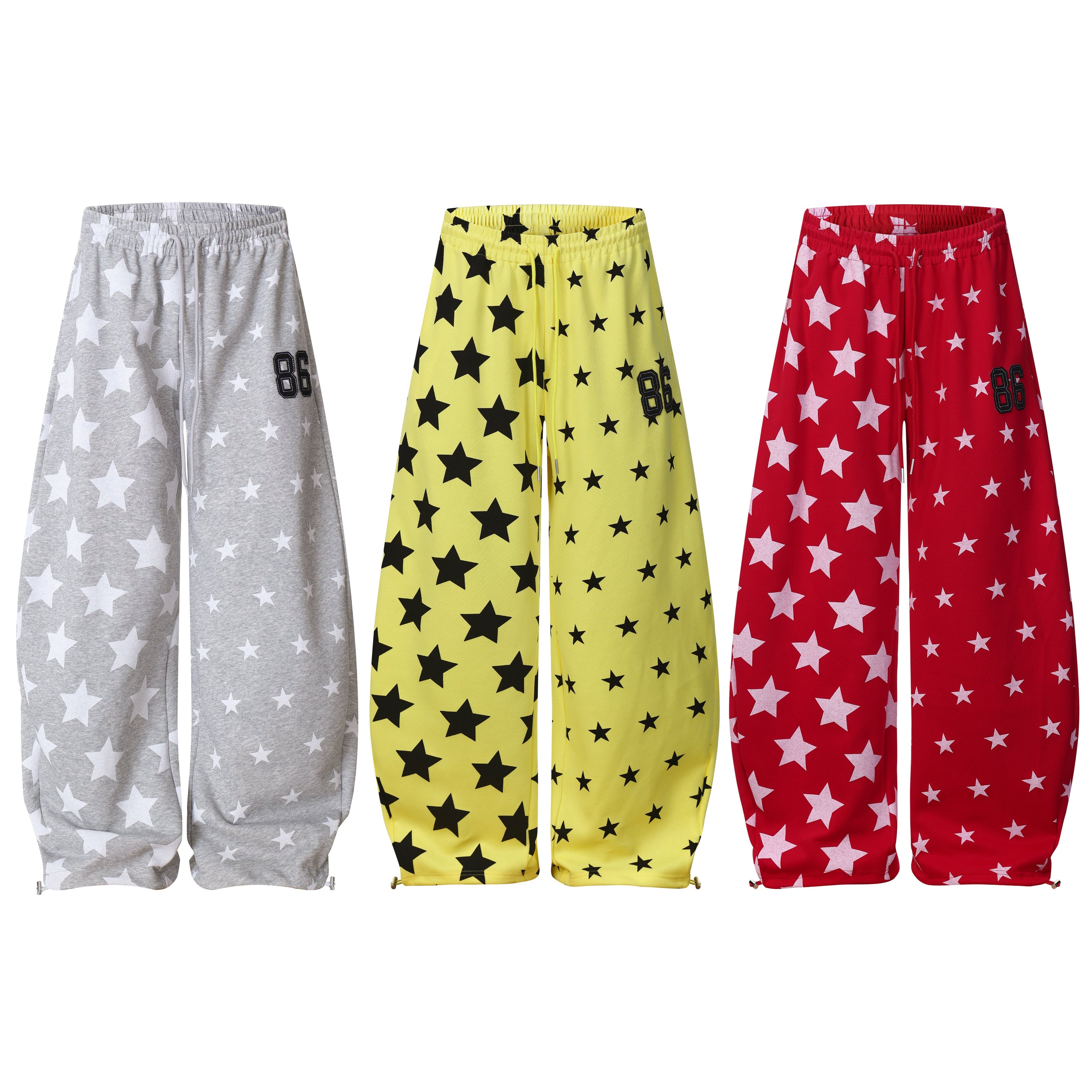 Grey wide-leg sweatpants with all-over white star print, elastic drawstring waist and embroidered 86 patch