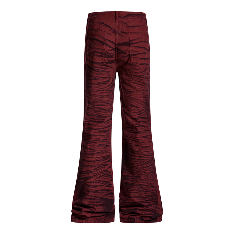 Back view of burgundy tiger-print flared pants with rear pockets