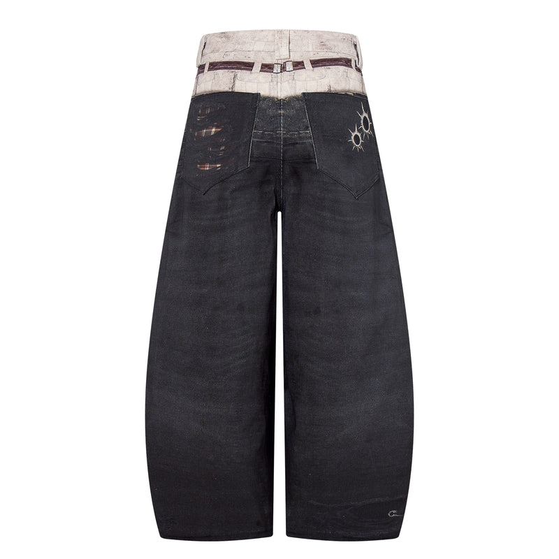 Back view of black wide-leg denim pants with printed waistband and distressed patch pockets