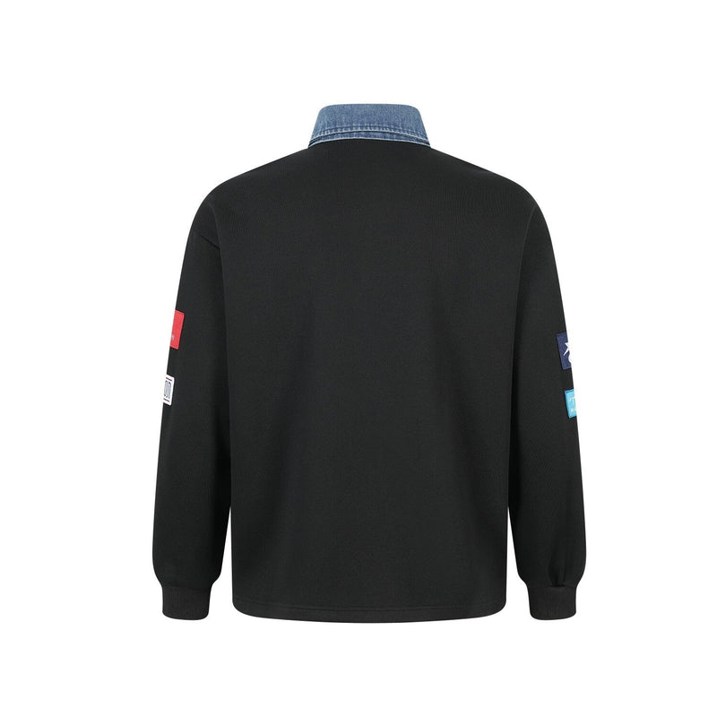 Back view of black patchwork polo sweatshirt with denim collar and long sleeves