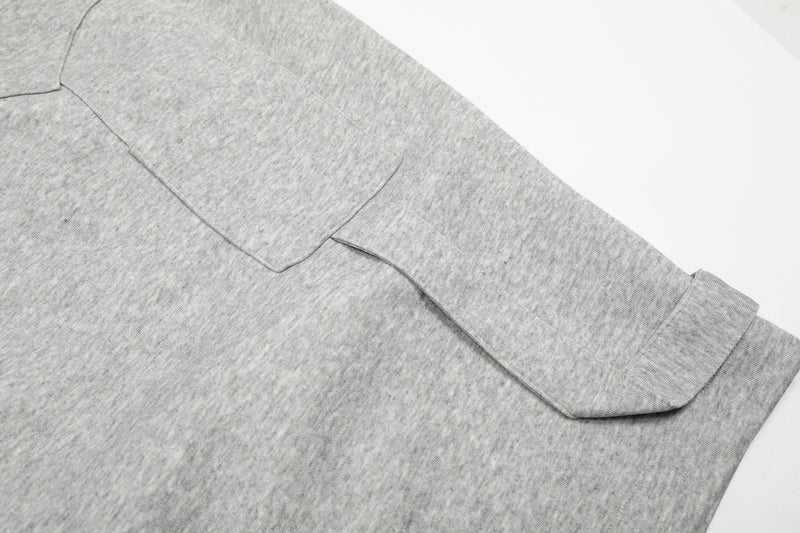 Gray side pocket and hem detail on wide lounge shorts