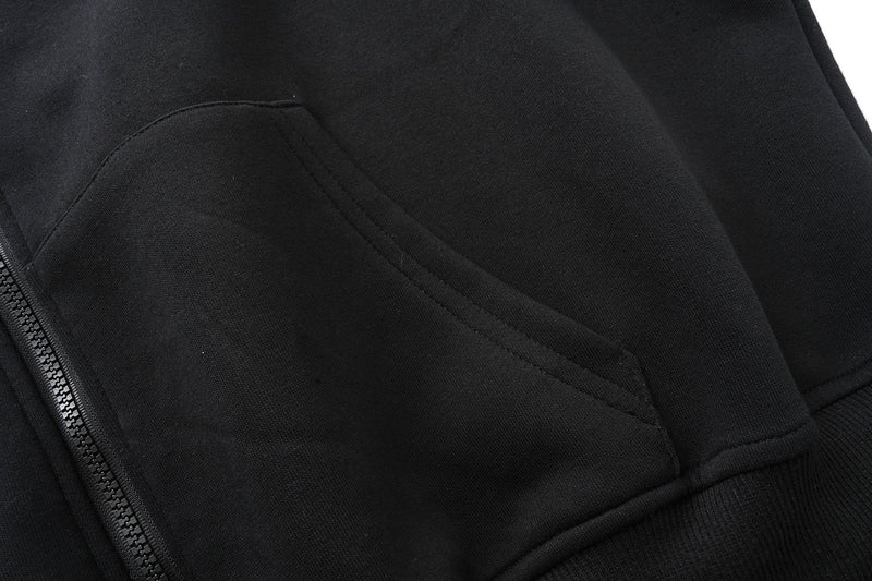 Close-up of black kangaroo pocket seam on the hoodie front