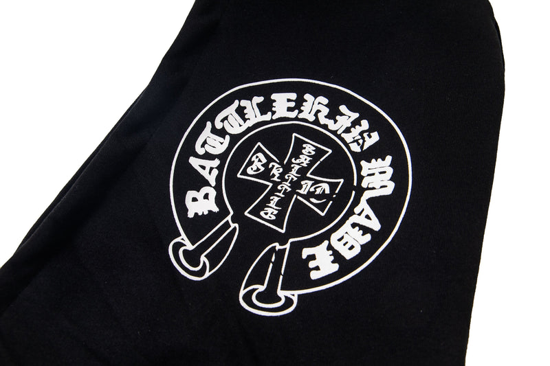 Close-up of black sleeve showing circular white graphic print