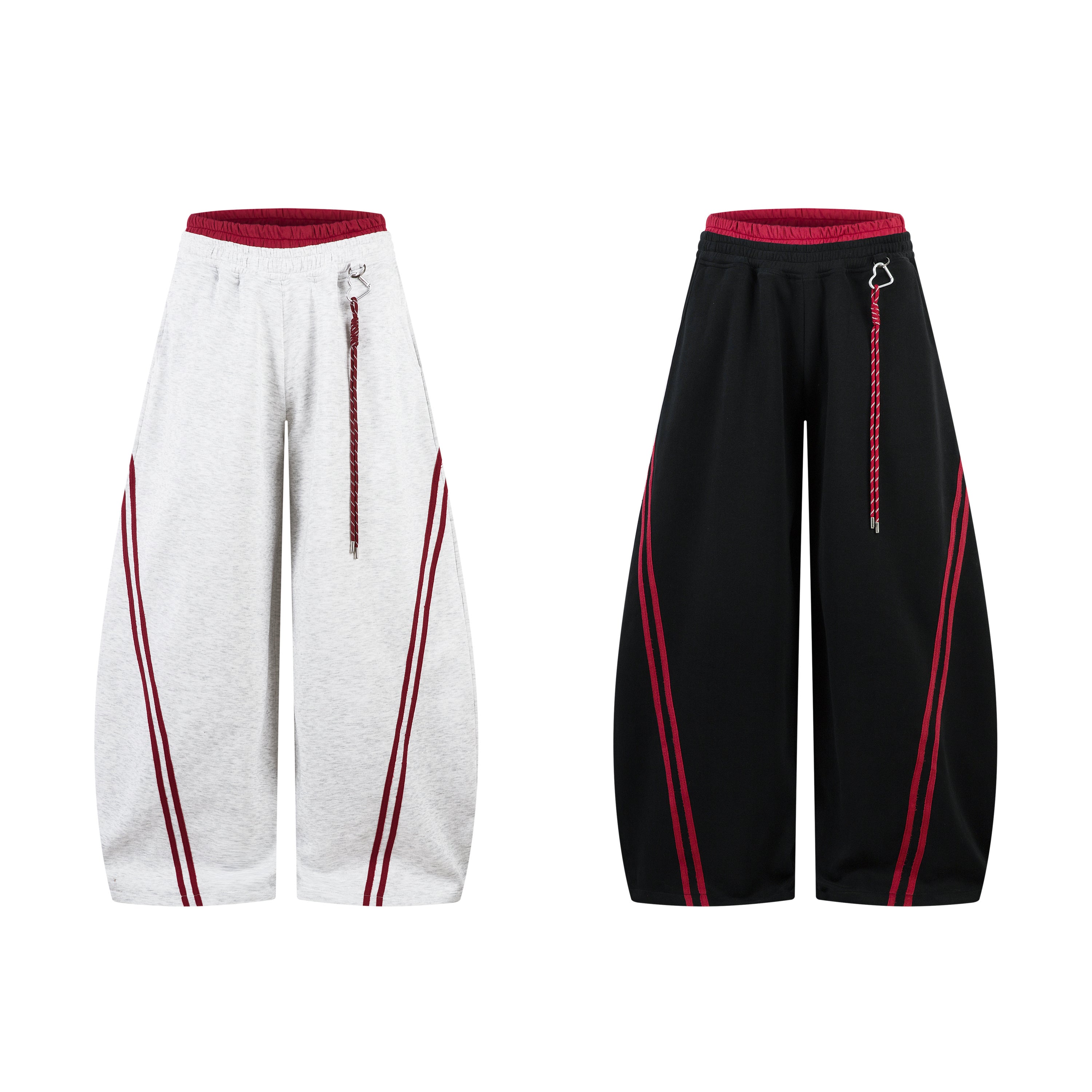 Light grey marl and black barrel-leg sweatpants with double red stripes and braided drawcord, shown side by side