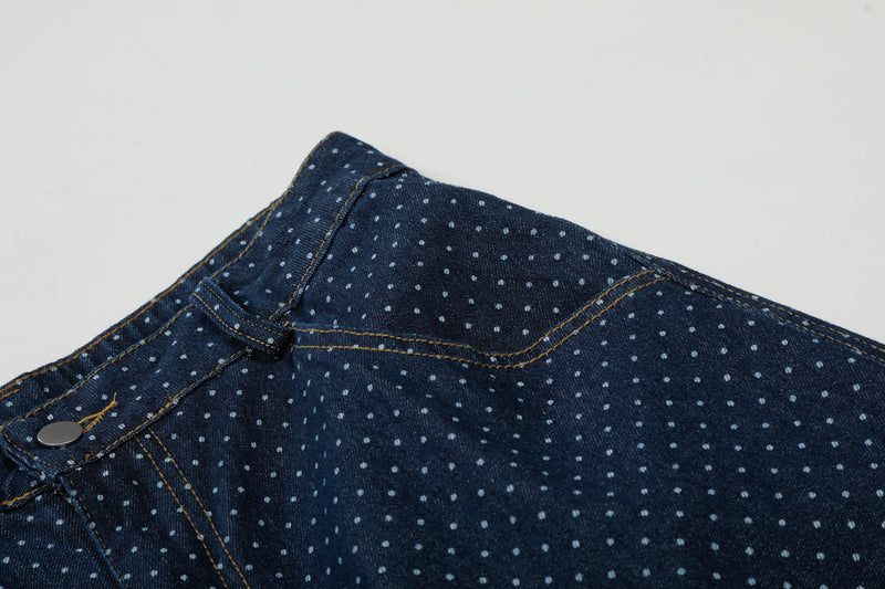 Close-up of waistband and upper side seam on navy polka dot denim cargo shorts