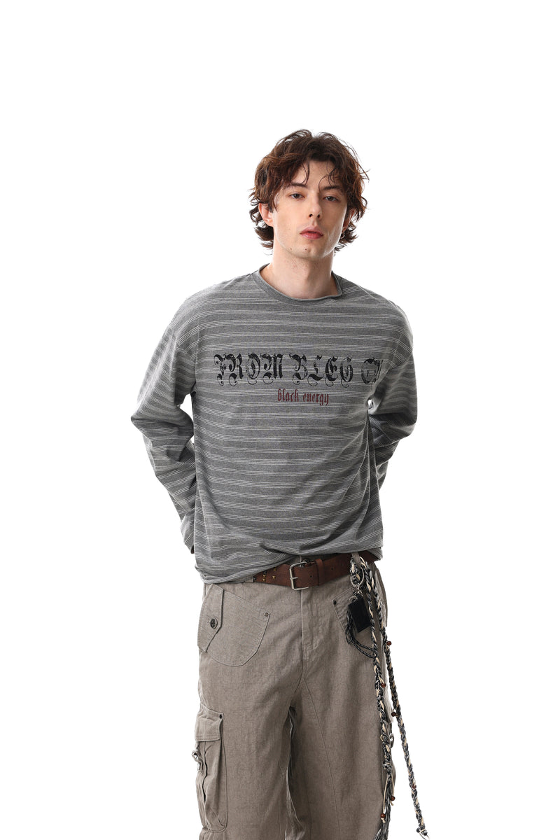 Model wearing gray striped long sleeve tee with Gothic logo and black-red chest print, front view