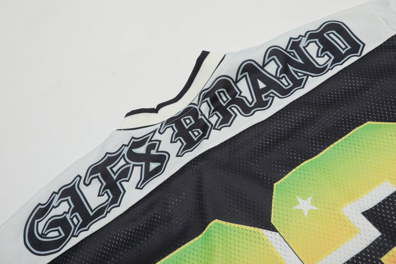 Black football jersey with white sleeve trim, bold graphic lettering, and a green-yellow number 23 on textured fabric