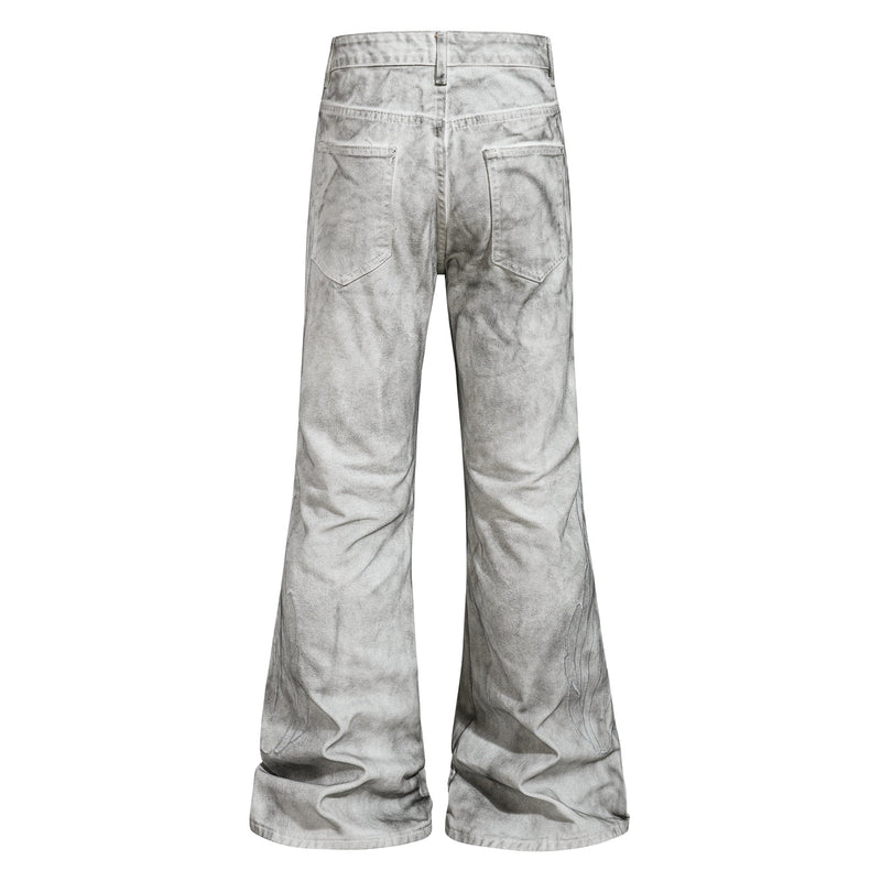 Back view of light gray washed cargo flare jeans with patch pockets