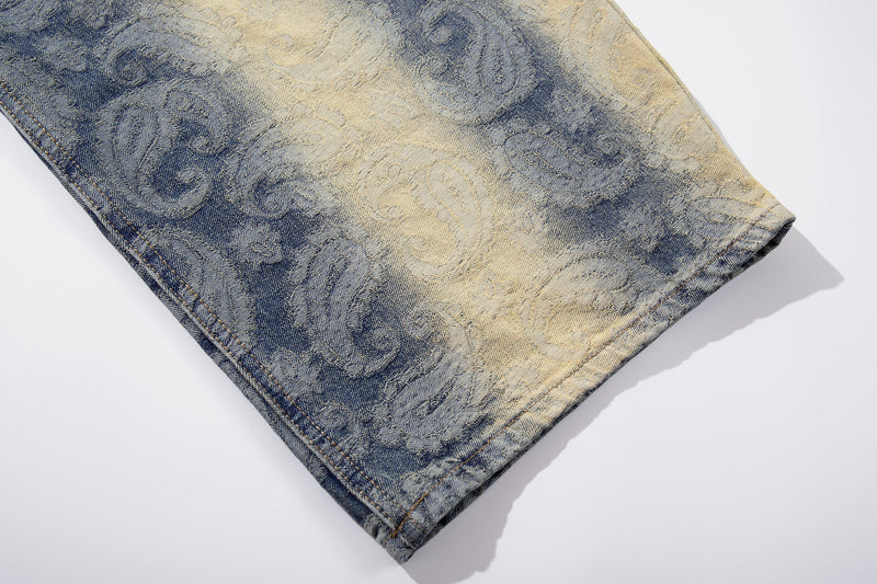 Cuffed hem detail on faded paisley denim jeans