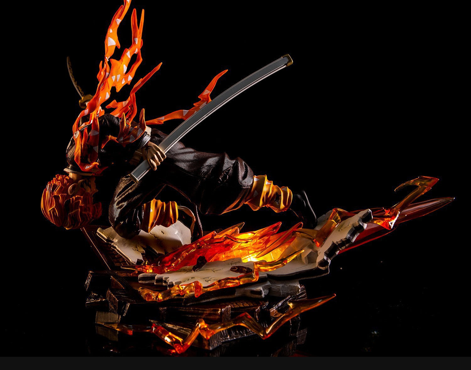 The Demon Slayer Flame Hashira Rengoku Kyojuro figure, a 28cm high-quality PVC piece, features his dynamic pose with flaming hair and clothing. Translucent orange flames add movement and energy as he wields his sword against a dark background.