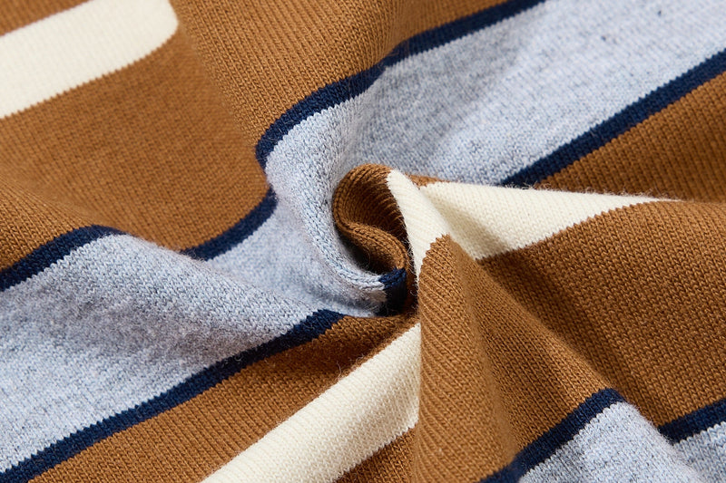 Close-up of brown, light blue and cream striped knit fabric on a vintage varsity tee with sporty texture