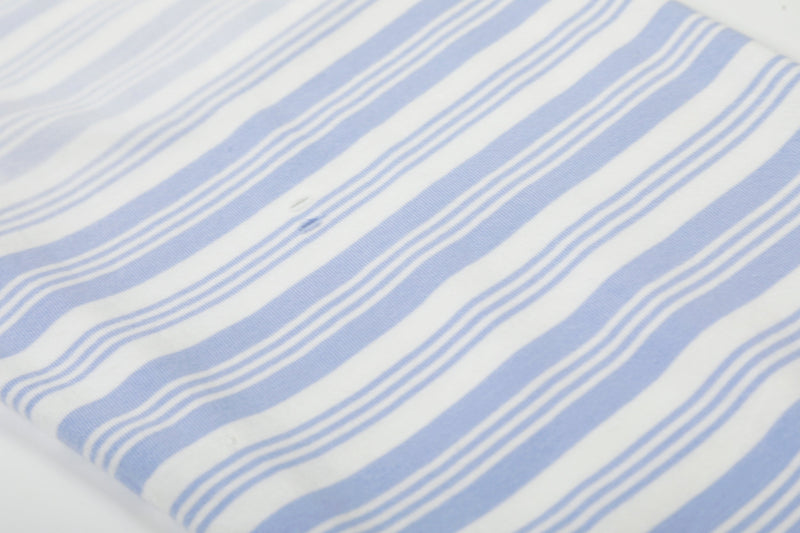 Plain striped fabric close-up showing light blue and white horizontal bands