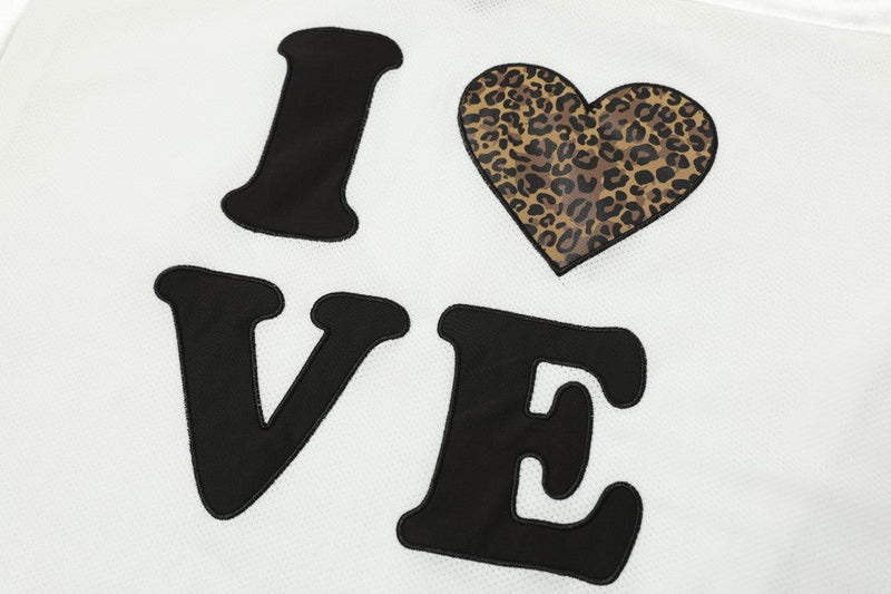 White mesh jersey with black I LOVE lettering and a leopard print heart graphic on the chest