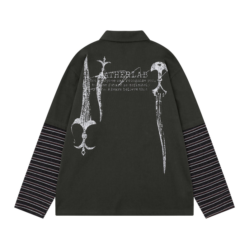 Back of black long sleeve polo with large white graphic print and striped sleeves