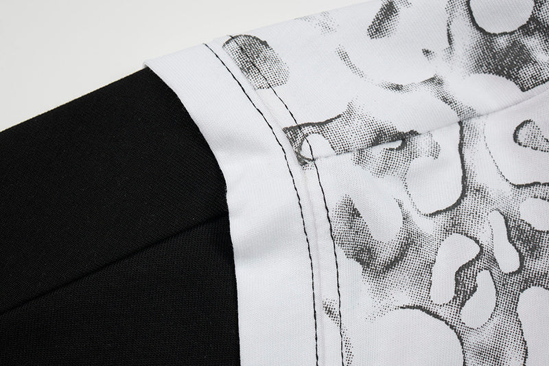 Black and white layered mesh graphic T-shirt with abstract leopard print detailing on the hem and side panel