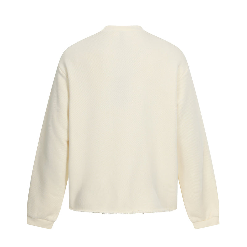 Back view of cream sweatshirt showing textured fabric and ribbed collar