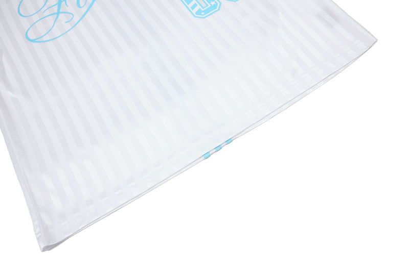White striped football jersey with pale blue script logo and subtle pinstripes, shown in a clean close-up