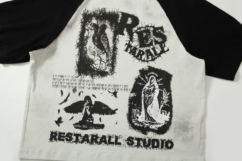 Distressed black and white raglan graphic tee with bold underground print and gothic streetwear artwork