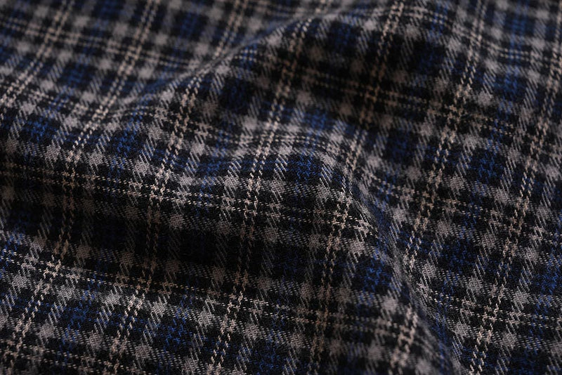Close-up of dark plaid cotton fabric with blue and beige woven pattern