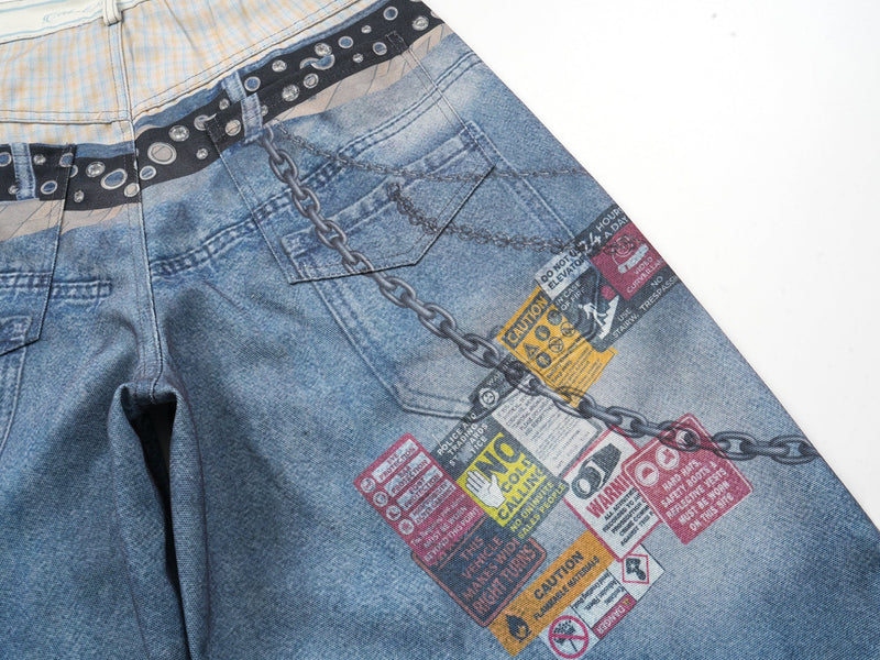 Close-up of the back pocket area with chain print and warning label graphics