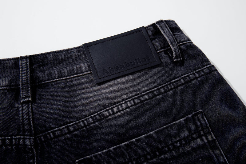 Branded waistband close-up on dark wash denim jeans