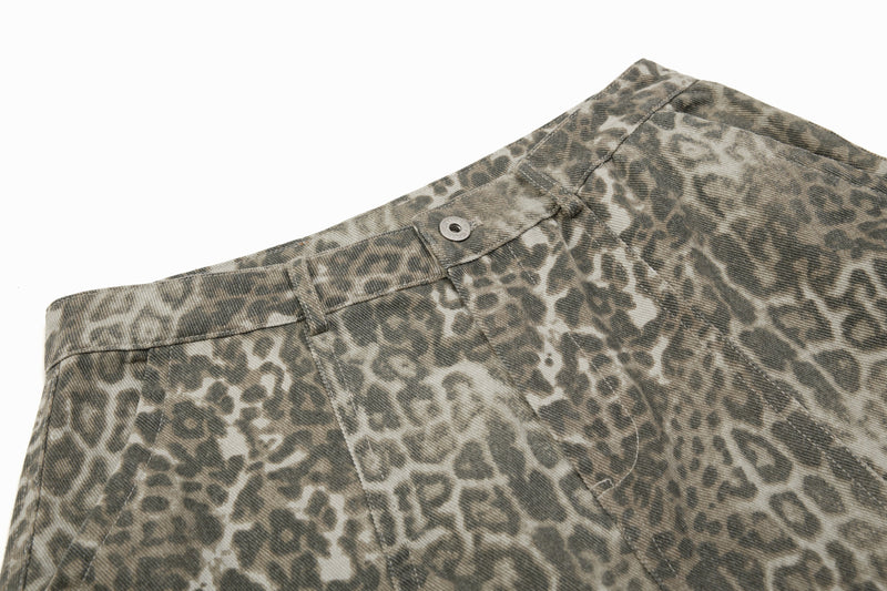 Close-up of leopard print waistband with button closure and belt loops