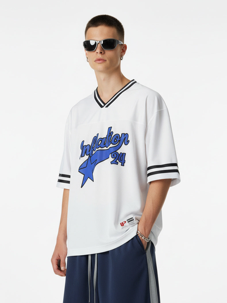 White mesh varsity jersey with blue star graphic and black striped trim, styled on a model with sunglasses