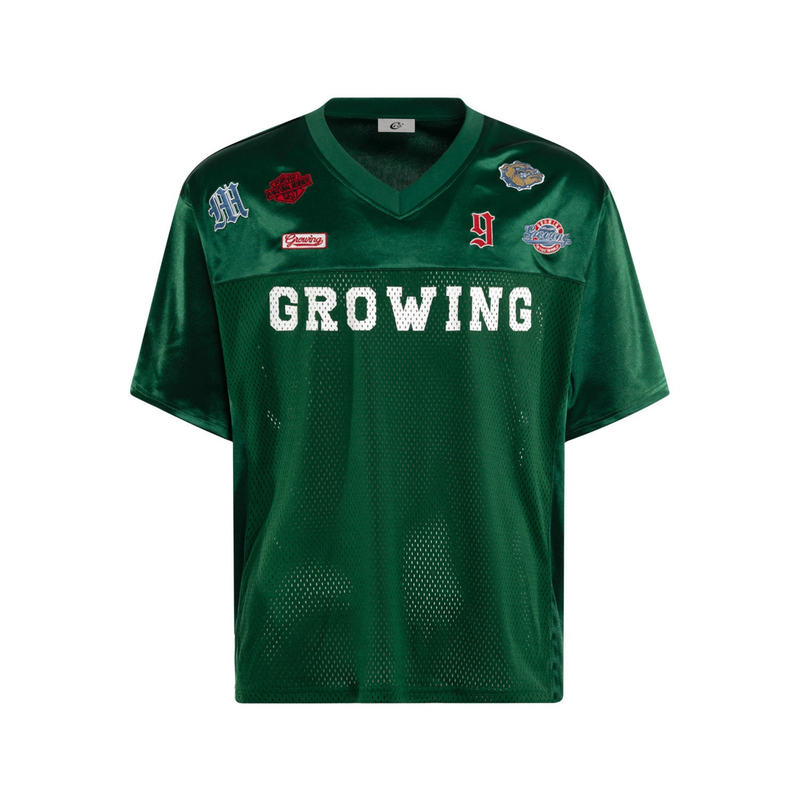Green mesh football jersey tee with V-neck, patch graphics, and bold GROWING lettering on the chest