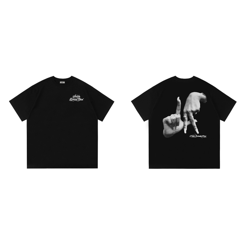 Black oversized tee with Saludo Estevan Oriol script logo and large monochrome hand graphic on the back