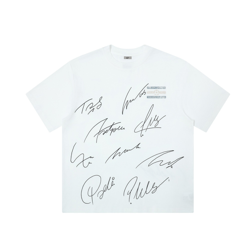 White graphic tee with oversized black autograph-style signatures across the front and subtle chest logo detail