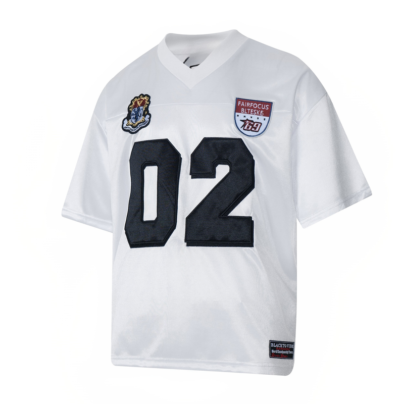 White varsity-style mesh football jersey with black number 02 and embroidered patches on the chest and hem
