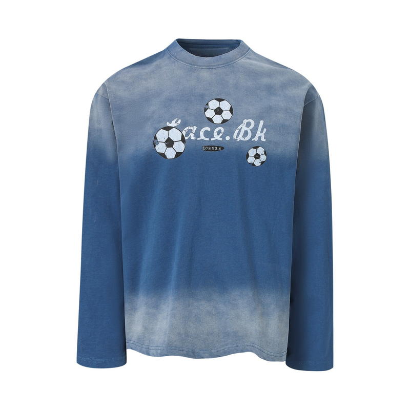 Blue long-sleeve tee front view with soccer ball graphics and distressed text print