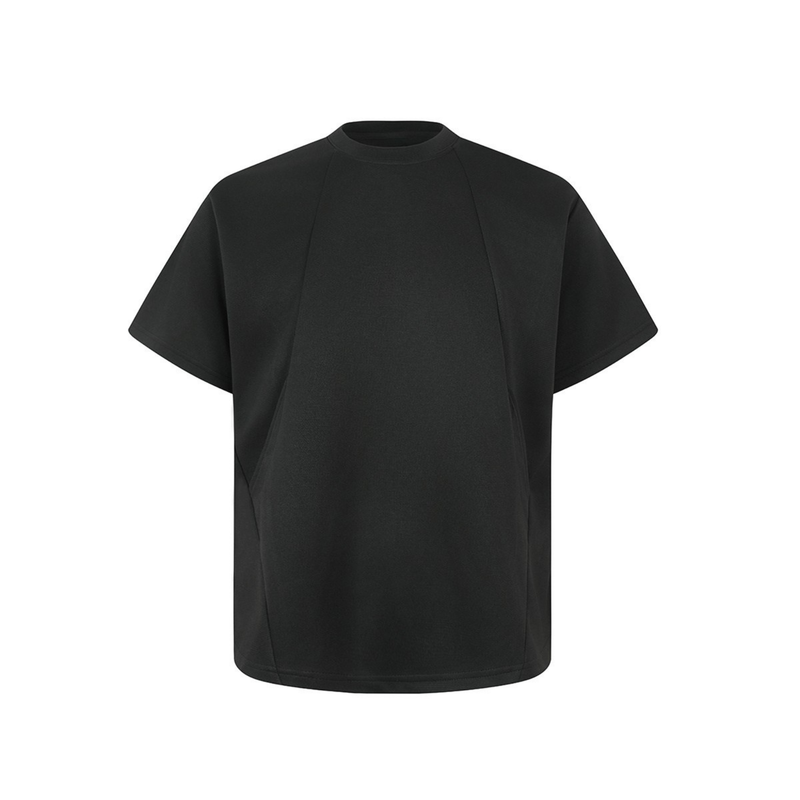 Black oversized tee with geometric seam detailing, short sleeves, and a structured crew neck on a white background