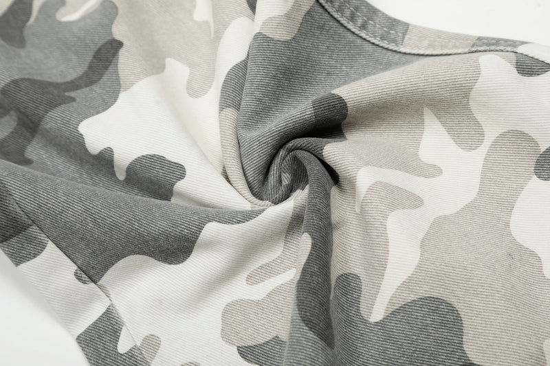 Close-up of folded camo fabric showing the textured weave of the cargo pants