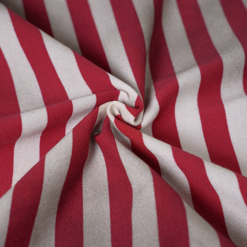 Close-up of red and white striped polo tee fabric with soft knit texture and gathered folds