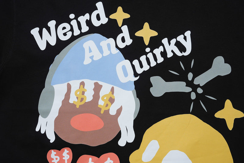 Black graphic tee with a quirky cartoon face, dollar signs, bone icon, and the words Weird And Quirky